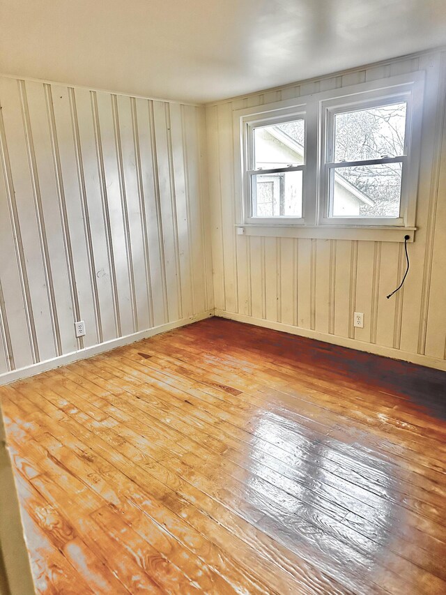 unfurnished room with light wood-type flooring