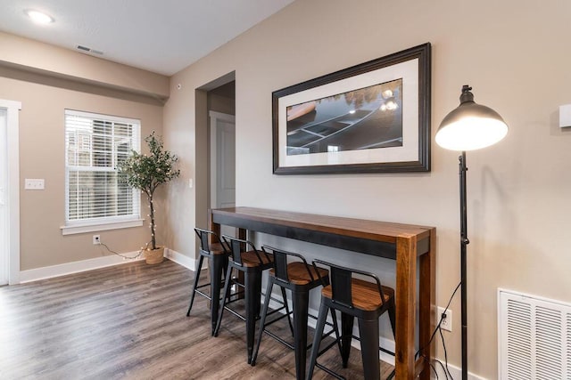 dining room featuring dark hardwood / wood-style flooring