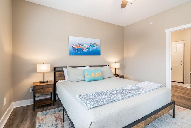 bedroom with dark hardwood / wood-style flooring and ceiling fan