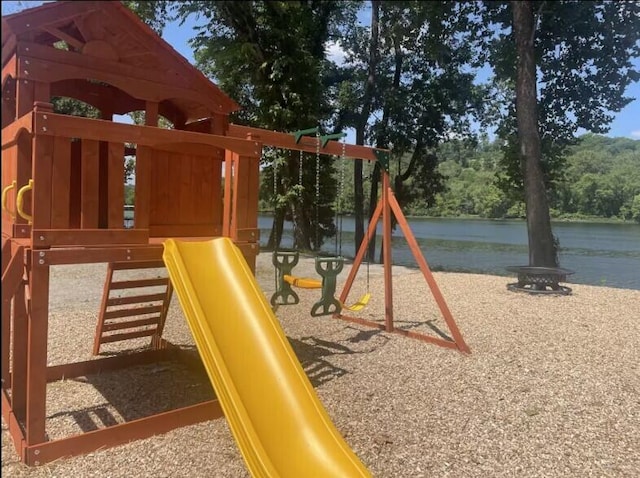 view of jungle gym with a water view