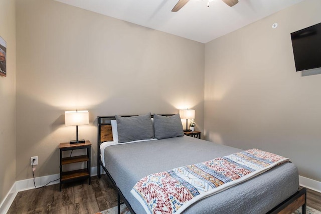 bedroom featuring ceiling fan and dark hardwood / wood-style flooring