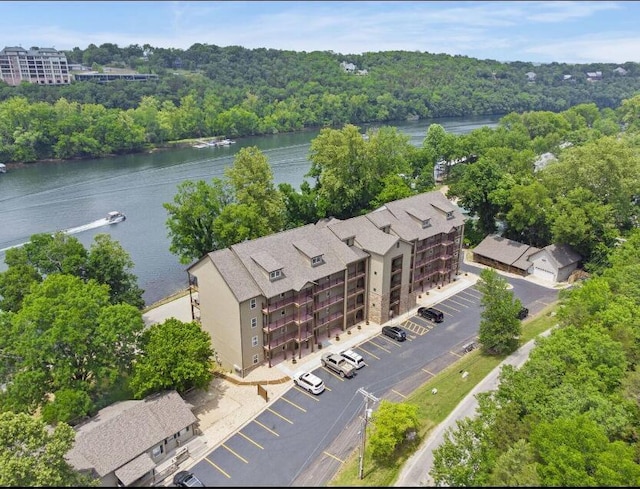 birds eye view of property with a water view