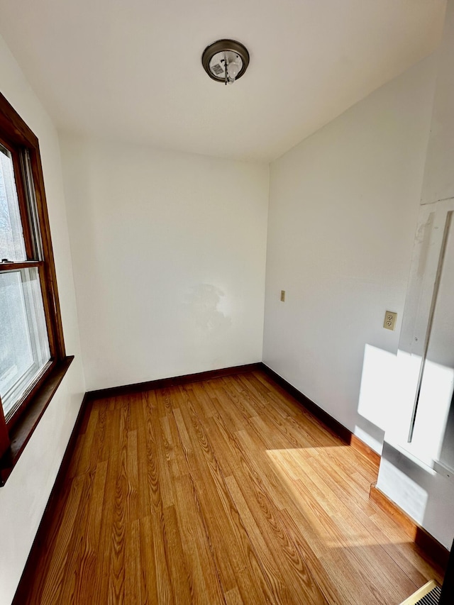 unfurnished room featuring light wood-type flooring