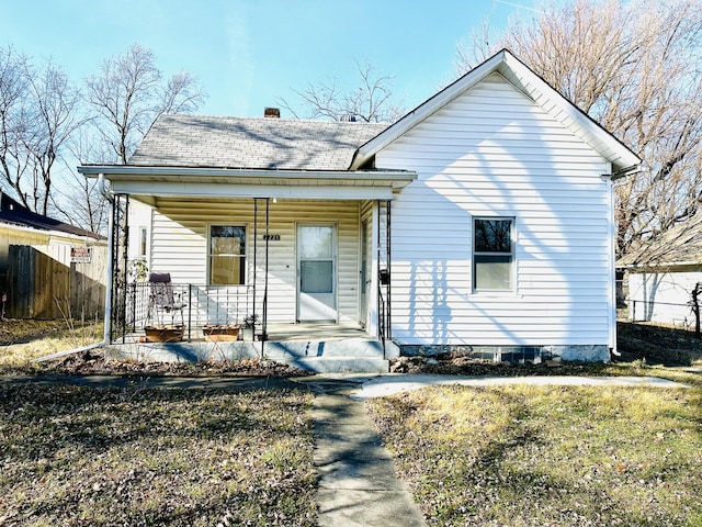 view of front of home featuring a front lawn and a porch