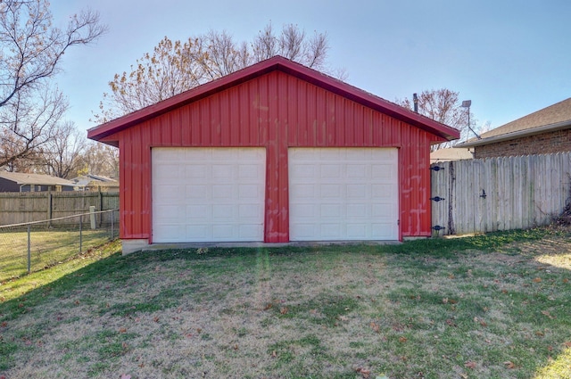 garage featuring a yard