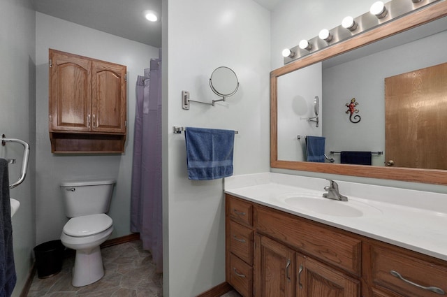 bathroom with tile patterned floors, vanity, and toilet