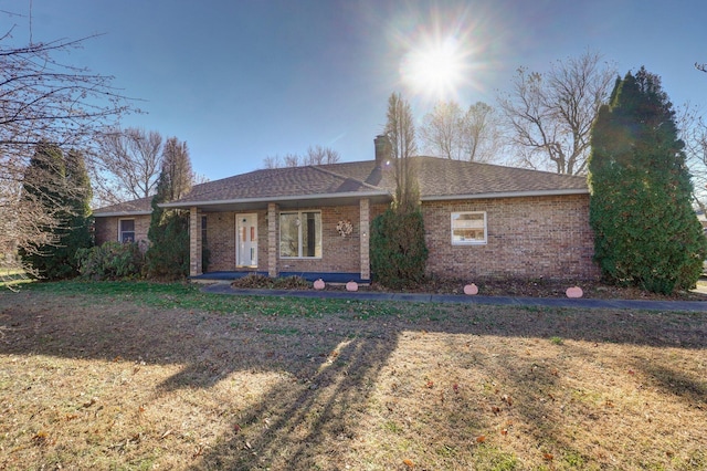 ranch-style home with a front yard