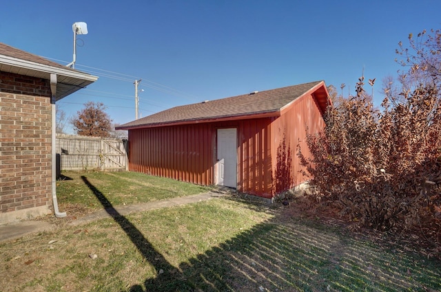 view of outdoor structure featuring a lawn