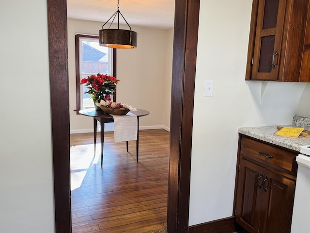 hallway featuring dark hardwood / wood-style floors