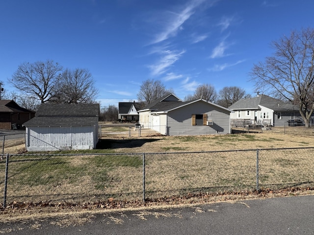 exterior space with a storage unit and a lawn