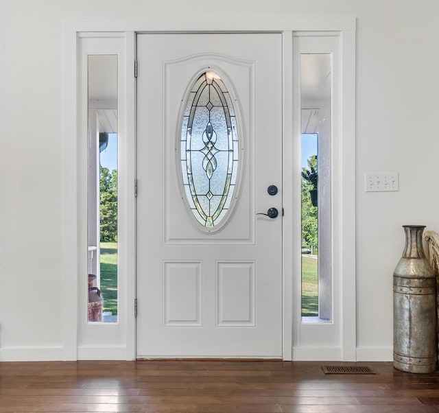 entryway with dark hardwood / wood-style floors