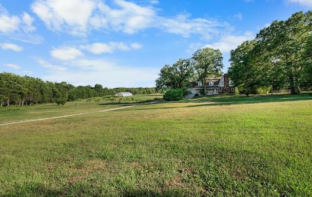 view of yard with a rural view