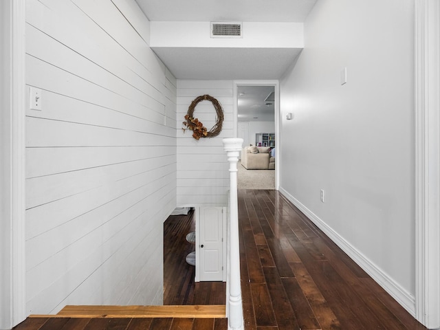 hall with dark hardwood / wood-style flooring