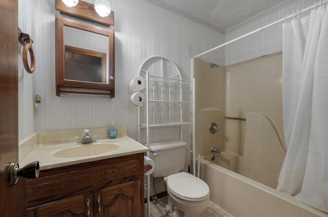 full bathroom with vanity, toilet, shower / bath combo with shower curtain, and a textured ceiling