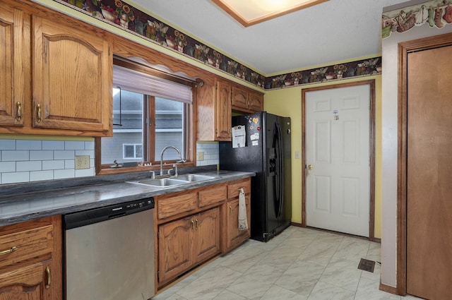 kitchen with tasteful backsplash, dishwasher, black fridge with ice dispenser, and sink