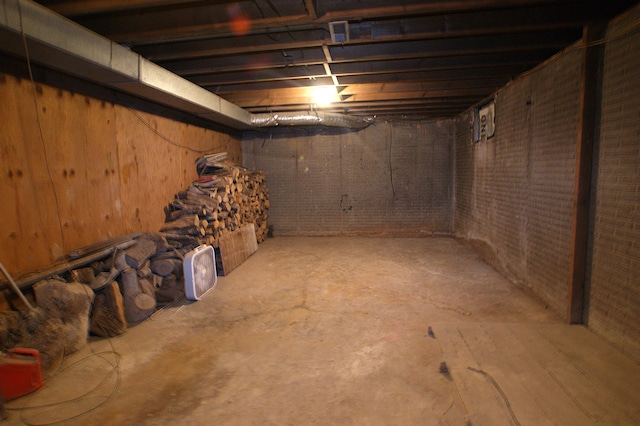 basement with brick wall