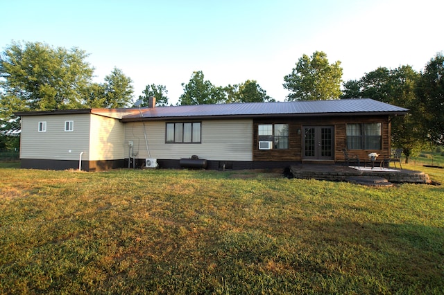 back of property with french doors, a yard, a patio, and cooling unit