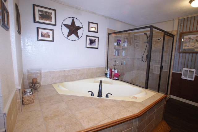 bathroom featuring shower with separate bathtub