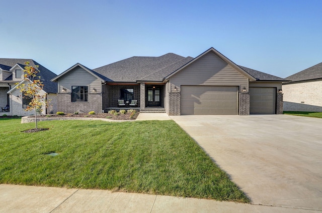 view of front facade featuring a garage and a front yard