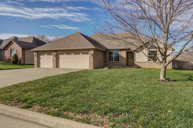 view of front facade featuring a garage and a front lawn