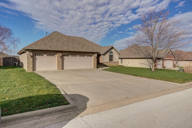 view of front facade with a front yard and a garage