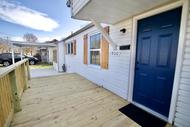 view of exterior entry with covered porch