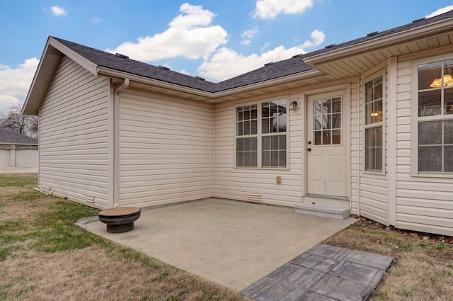 property entrance with a patio area