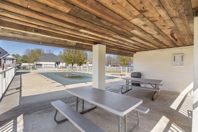 view of patio featuring a covered pool