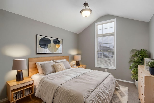 bedroom with carpet and lofted ceiling