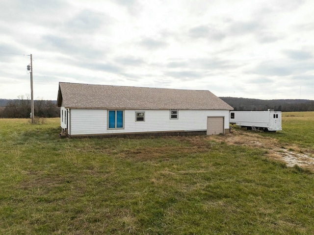 view of property exterior with a yard