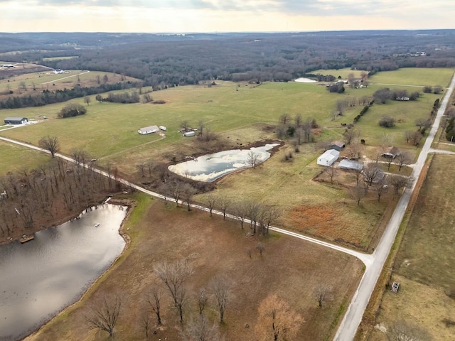 drone / aerial view with a water view and a rural view