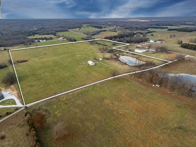 birds eye view of property featuring a rural view