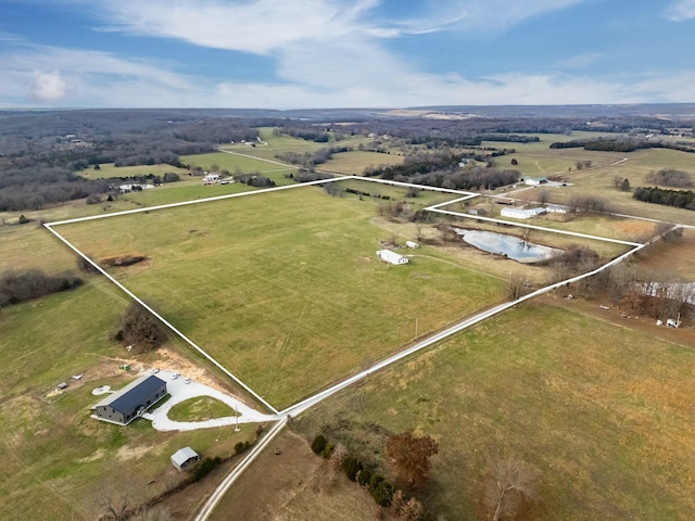 birds eye view of property with a rural view