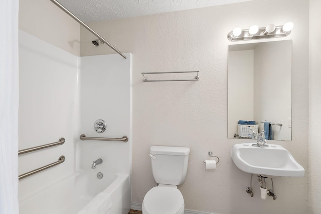 full bathroom with a textured ceiling, toilet, shower / bathtub combination, and sink