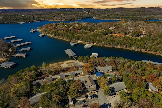 aerial view at dusk with a water view