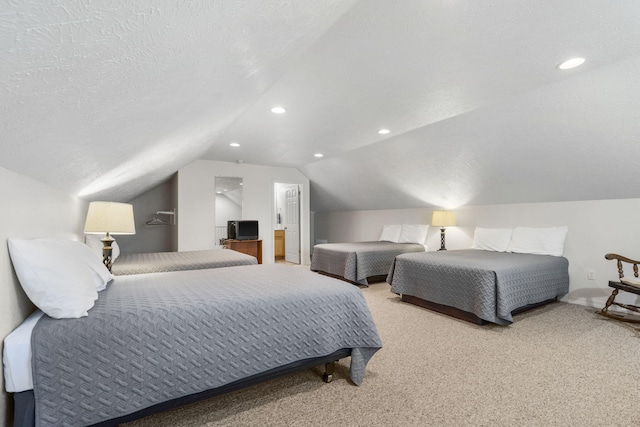 bedroom with light carpet, a textured ceiling, and vaulted ceiling