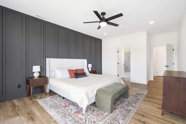 bedroom featuring ceiling fan and light hardwood / wood-style floors