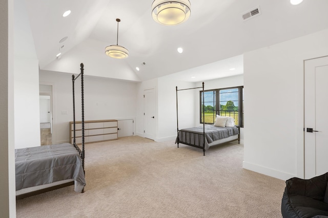 carpeted bedroom with lofted ceiling