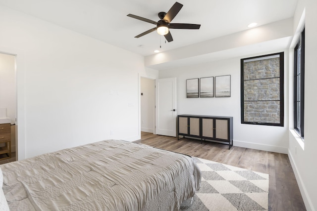 bedroom featuring hardwood / wood-style floors and ceiling fan