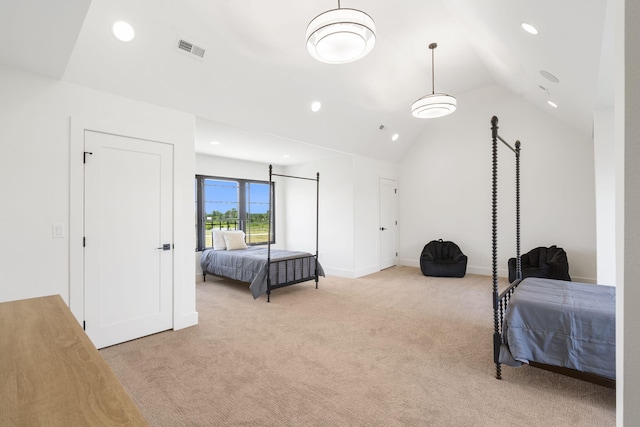 carpeted bedroom featuring lofted ceiling