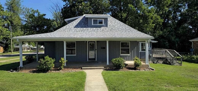 bungalow-style home featuring a carport and a front lawn