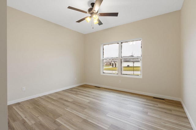 spare room with ceiling fan and light hardwood / wood-style floors