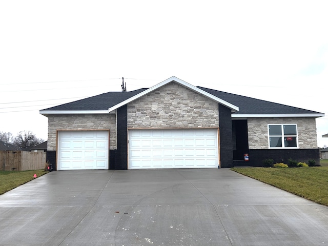 ranch-style home featuring a garage