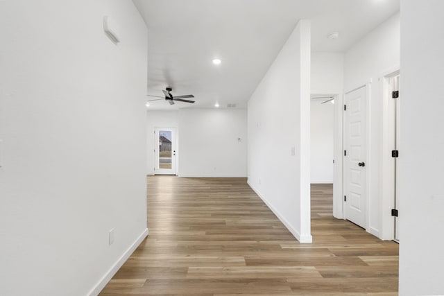 hallway with light wood-type flooring