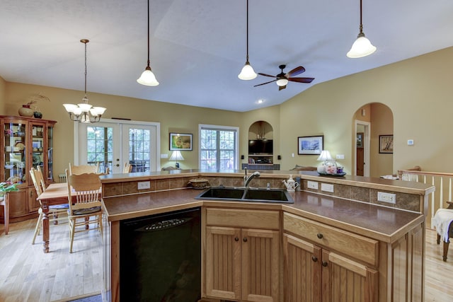 kitchen featuring dishwasher, a center island, hanging light fixtures, and sink