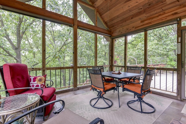 sunroom / solarium featuring a wealth of natural light and lofted ceiling