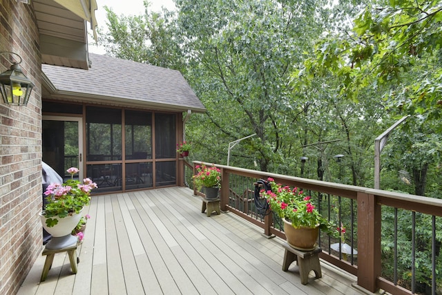 wooden deck featuring a sunroom