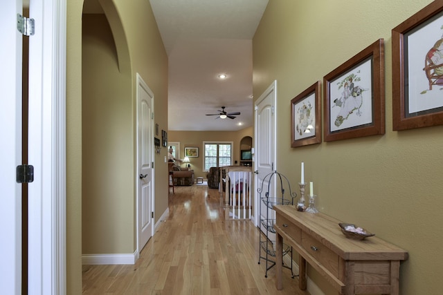 corridor with light hardwood / wood-style flooring