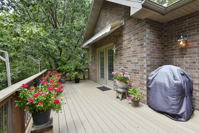 wooden deck with area for grilling