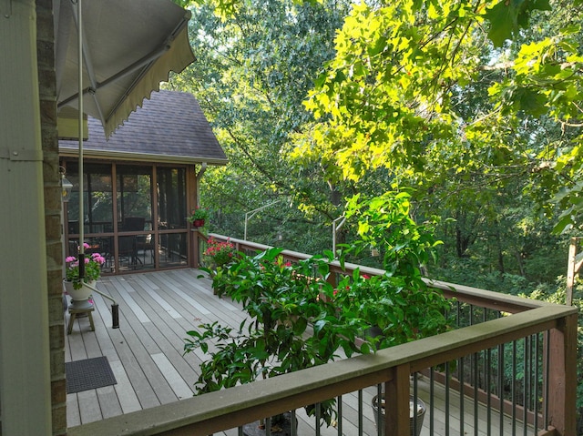 wooden terrace with a sunroom